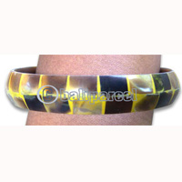 Wooden Bracelet From Albesia Wood With Coconut Inlaid With Resin.