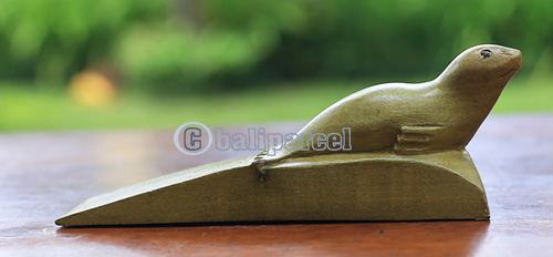 Wooden Door Stop With Sea Dog Carving, Made From Waru Wood